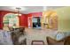 Open-concept living room featuring tile floors, colorful walls, and abundant natural light at 3101 Margarita St, Pahrump, NV 89048
