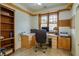 Office space with built-in desk, and shelving, plus a large window at 3101 Margarita St, Pahrump, NV 89048