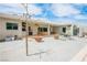 Spacious backyard patio with a covered lounge area, potted plants, and ample seating for outdoor gatherings at 3101 Margarita St, Pahrump, NV 89048