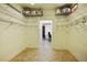 Spacious walk-in closet featuring metal shelving and archway to bonus room at 3101 Margarita St, Pahrump, NV 89048