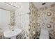 Unique powder room featuring a stylish sink, toilet, and colorful patterned wallpaper at 3111 Bel Air Dr # 3C, Las Vegas, NV 89109