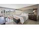 Serene bedroom with a mirrored wall, comfortable bed, and abundant natural light at 3111 Bel Air Dr # 3C, Las Vegas, NV 89109