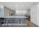 Modern kitchen featuring white cabinets, stainless steel appliances, and a sleek countertop at 3111 Bel Air Dr # 3C, Las Vegas, NV 89109