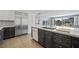 Well-equipped kitchen featuring stainless steel appliances and dark-toned lower cabinets at 3111 Bel Air Dr # 3C, Las Vegas, NV 89109