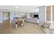 Open-concept living space with dining area and a glimpse into the modern kitchen at 3111 Bel Air Dr # 3C, Las Vegas, NV 89109
