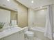 Clean bathroom with marble vanity, a soaking tub, and shower combination at 322 Karen Ave # 708, Las Vegas, NV 89109