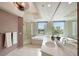 Bright bathroom with double sinks, garden tub, and glass shower with nice views at 322 Karen Ave # 708, Las Vegas, NV 89109