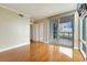 Bedroom featuring hardwood floors, balcony access, and closet at 322 Karen Ave # 708, Las Vegas, NV 89109