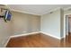 Bedroom featuring hardwood floors, a mounted television, and ample natural light at 322 Karen Ave # 708, Las Vegas, NV 89109