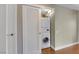 Efficient laundry closet with stacked washer and dryer and storage space at 322 Karen Ave # 708, Las Vegas, NV 89109