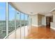Bright living room featuring floor-to-ceiling windows with city views and hardwood floors at 322 Karen Ave # 708, Las Vegas, NV 89109