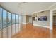 The large living room features light walls, wood floors, and floor to ceiling windows at 322 Karen Ave # 708, Las Vegas, NV 89109