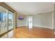 Open concept living room with wood floors and sliding door to balcony at 322 Karen Ave # 708, Las Vegas, NV 89109