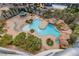 An aerial view of the pool, including lush landscaping and a spa at 322 Karen Ave # 708, Las Vegas, NV 89109