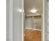 Walk-in closet with wood floor and built in shelving unit at 322 Karen Ave # 708, Las Vegas, NV 89109