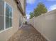Featuring backyard patio, rock landscaping, and privacy fence at 3795 Canis Minor Ln # 5102, Henderson, NV 89052