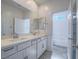 Bright, well-lit bathroom with double vanity and large mirror at 3795 Canis Minor Ln # 5102, Henderson, NV 89052