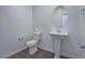 Clean half-bath with pedestal sink, modern fixtures, and tile floors at 3795 Canis Minor Ln # 5102, Henderson, NV 89052