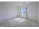 A bright bedroom with a large window and neutral carpet at 3795 Canis Minor Ln # 5102, Henderson, NV 89052