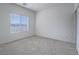 Bedroom with neutral carpet, baseboards and walls with window and view at 3795 Canis Minor Ln # 5102, Henderson, NV 89052