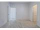 Carpeted bedroom featuring three doors and an empty wall at 3795 Canis Minor Ln # 5102, Henderson, NV 89052