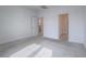 Spacious carpeted bedroom with two open doorways to other rooms at 3795 Canis Minor Ln # 5102, Henderson, NV 89052