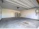 Spacious garage with large water heater, storage rack and concrete flooring at 3795 Canis Minor Ln # 5102, Henderson, NV 89052
