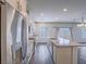 Bright kitchen with stainless steel appliances, white cabinets, and an island at 3795 Canis Minor Ln # 5102, Henderson, NV 89052