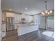 Well-lit kitchen featuring stainless steel appliances and a large center island with granite countertops at 3795 Canis Minor Ln # 5102, Henderson, NV 89052