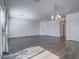 Spacious living room with gray wood-look flooring and neutral paint at 3795 Canis Minor Ln # 5102, Henderson, NV 89052
