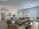 Staged living room featuring comfortable seating, dining area, and an open-concept kitchen at 3795 Canis Minor Ln # 5102, Henderson, NV 89052