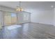 Bright, open living space with wood-look floors and sliding glass doors to the backyard at 3795 Canis Minor Ln # 5102, Henderson, NV 89052