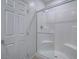 A standing shower with white tile and a glass door at 3795 Canis Minor Ln # 5102, Henderson, NV 89052