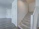 Open staircase with carpeted steps and white banister leading to the upper level at 3795 Canis Minor Ln # 5102, Henderson, NV 89052