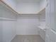 Walk-in closet with neutral carpet, white walls, and shelving at 3795 Canis Minor Ln # 5102, Henderson, NV 89052