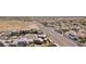 An aerial view showcases a neighborhood with modern homes and desert surroundings at 4001 Turquoise Falls St, Las Vegas, NV 89129