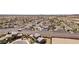 Quiet desert homes boast green grass and mature trees near an intersection at 4001 Turquoise Falls St, Las Vegas, NV 89129
