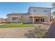This backyard has a covered patio, desert landscaping and a patch of artificial turf at 4001 Turquoise Falls St, Las Vegas, NV 89129