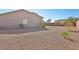 Low-maintenance backyard with desert landscaping, minimal green space, and block wall at 4001 Turquoise Falls St, Las Vegas, NV 89129