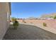Large backyard with desert landscaping, privacy wall, and beautiful mountain views at 4001 Turquoise Falls St, Las Vegas, NV 89129