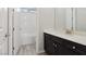 Modern bathroom featuring dark vanity, white countertop, and subway tile shower at 4001 Turquoise Falls St, Las Vegas, NV 89129
