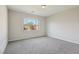 Bright bedroom with a view of trees and landscaping through a large window at 4001 Turquoise Falls St, Las Vegas, NV 89129