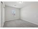 Bedroom with plush carpet, closet and a window offering natural light at 4001 Turquoise Falls St, Las Vegas, NV 89129