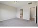 Spacious bedroom featuring plush carpet, neutral walls, and an ensuite bathroom for added privacy and convenience at 4001 Turquoise Falls St, Las Vegas, NV 89129