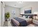 Staged bedroom with soft carpet, a large bed, stylish decor, and natural light at 4001 Turquoise Falls St, Las Vegas, NV 89129