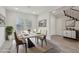 Staged dining area features contemporary table, modern decor, and sunlit windows at 4001 Turquoise Falls St, Las Vegas, NV 89129