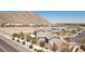 A single-Gathering home showcasing desert landscaping and mountain views in a residential neighborhood at 4001 Turquoise Falls St, Las Vegas, NV 89129