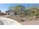 Inviting two-story home with a three-car garage and a professionally landscaped front yard at 4001 Turquoise Falls St, Las Vegas, NV 89129
