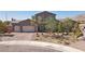 Beautiful two-story home with a three-car garage and professionally landscaped front yard at 4001 Turquoise Falls St, Las Vegas, NV 89129