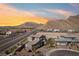 Exterior shot showcasing neighborhood street, desert landscape, and mountain views at 4001 Turquoise Falls St, Las Vegas, NV 89129
